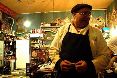 Chef Moustafa El Sayed standing in his hand-mosaicked Mombar kitchen